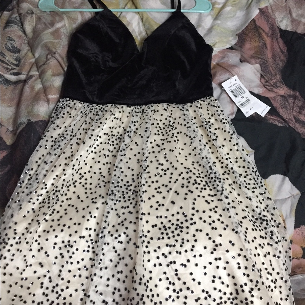 A black satin off white dress with black spots